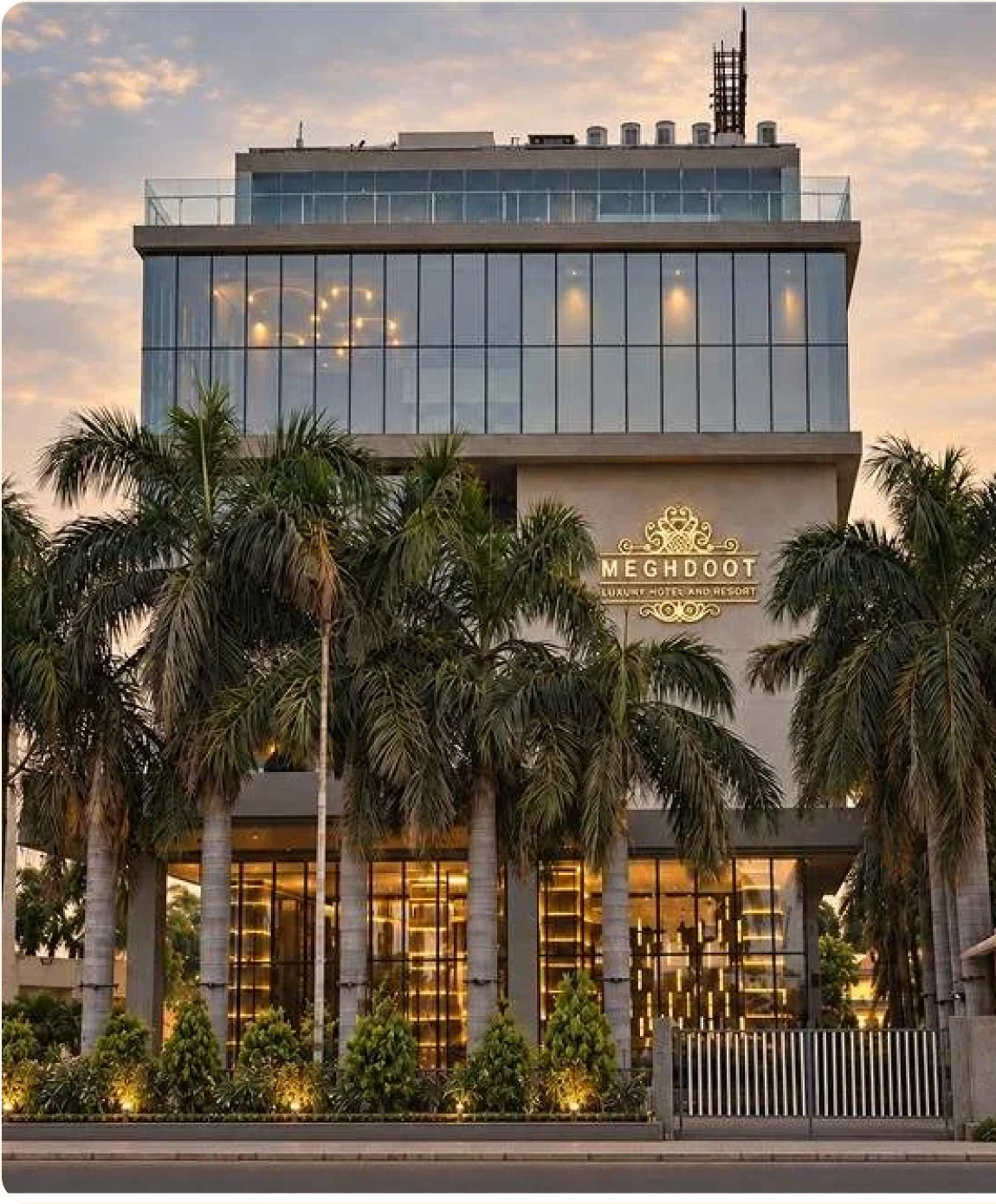 Meghdoot Luxury Hotel and Resort building at dusk